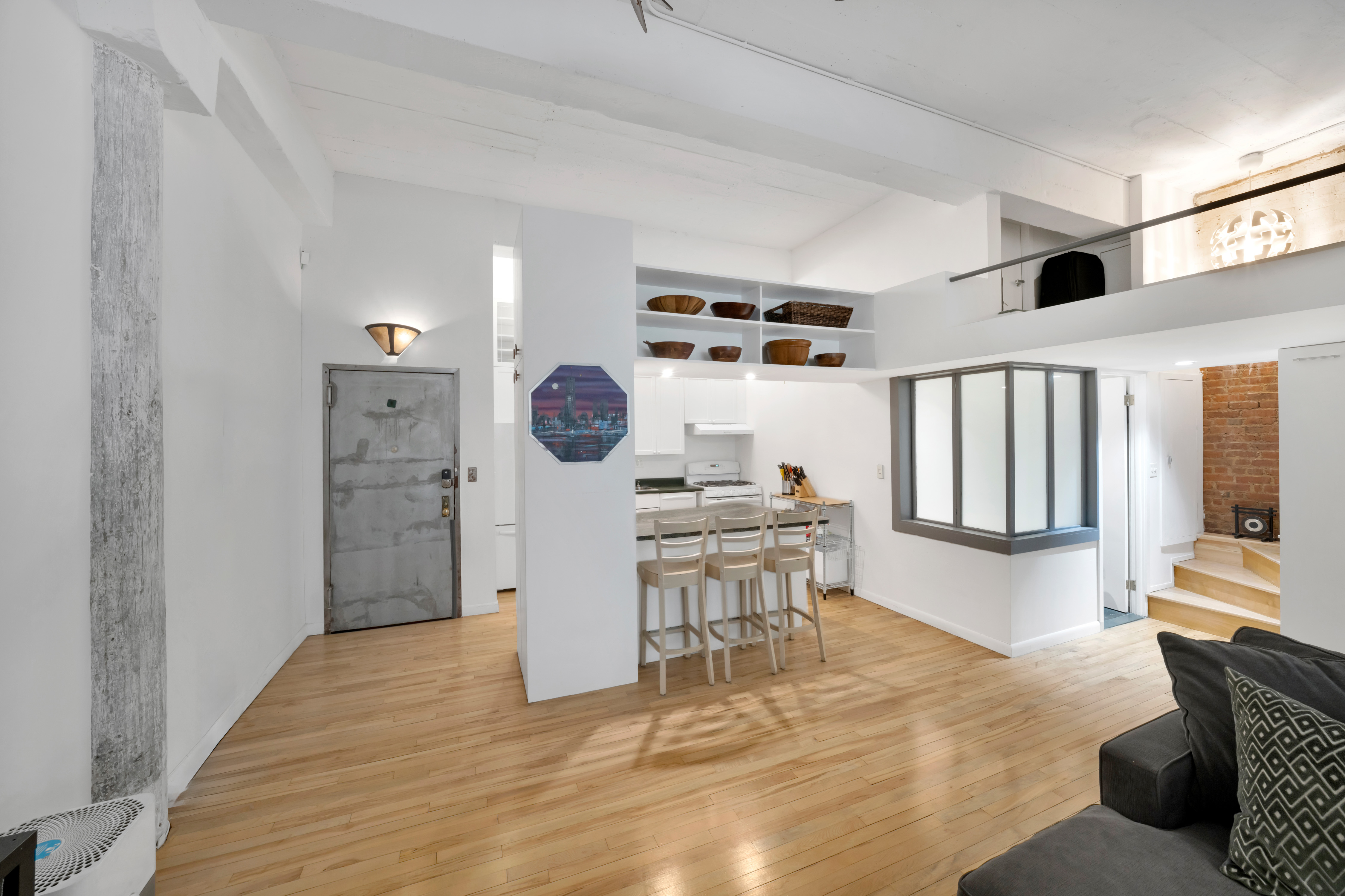 415 West 55th Street, Unit 4D Manhattan, NY 10019 - Photo 3 of 12 a view of kitchen with furniture and wooden floor