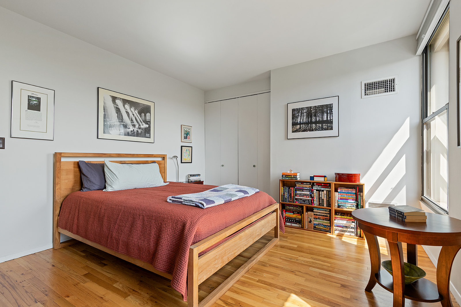 1 Tiffany Place, Unit 4B Brooklyn, NY 11231 - Photo 4 of 6 a bedroom with a bed and a table