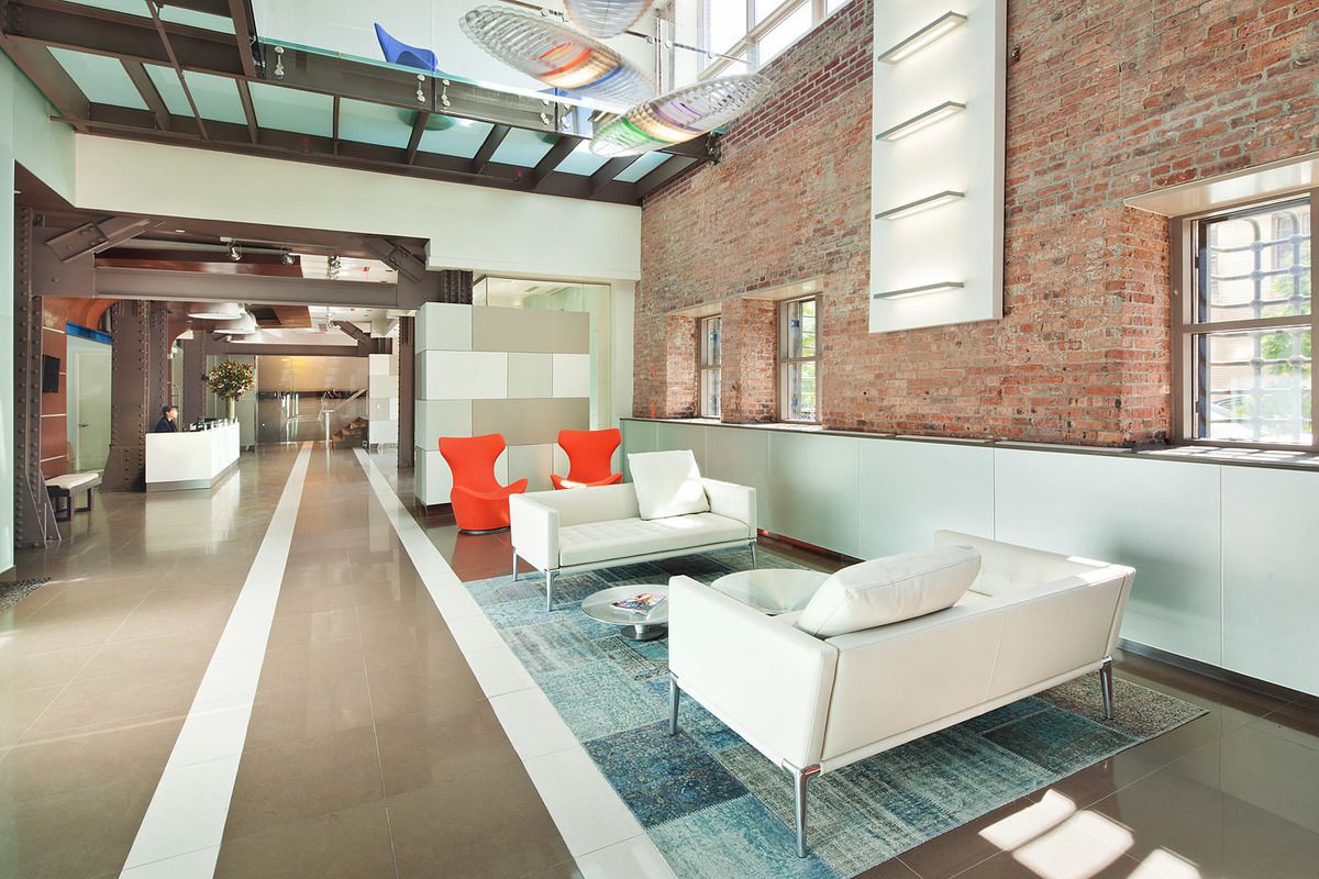 2-17 51st Avenue, Unit 606 Queens, NY 11101 - Photo 17 of 18 a living room with furniture and a table