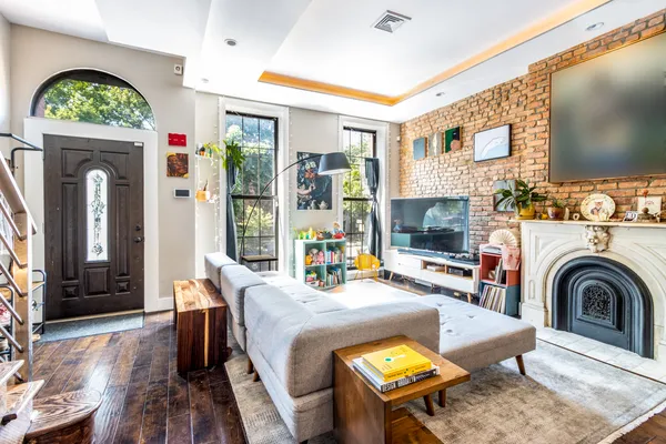 a living room with furniture and a fireplace