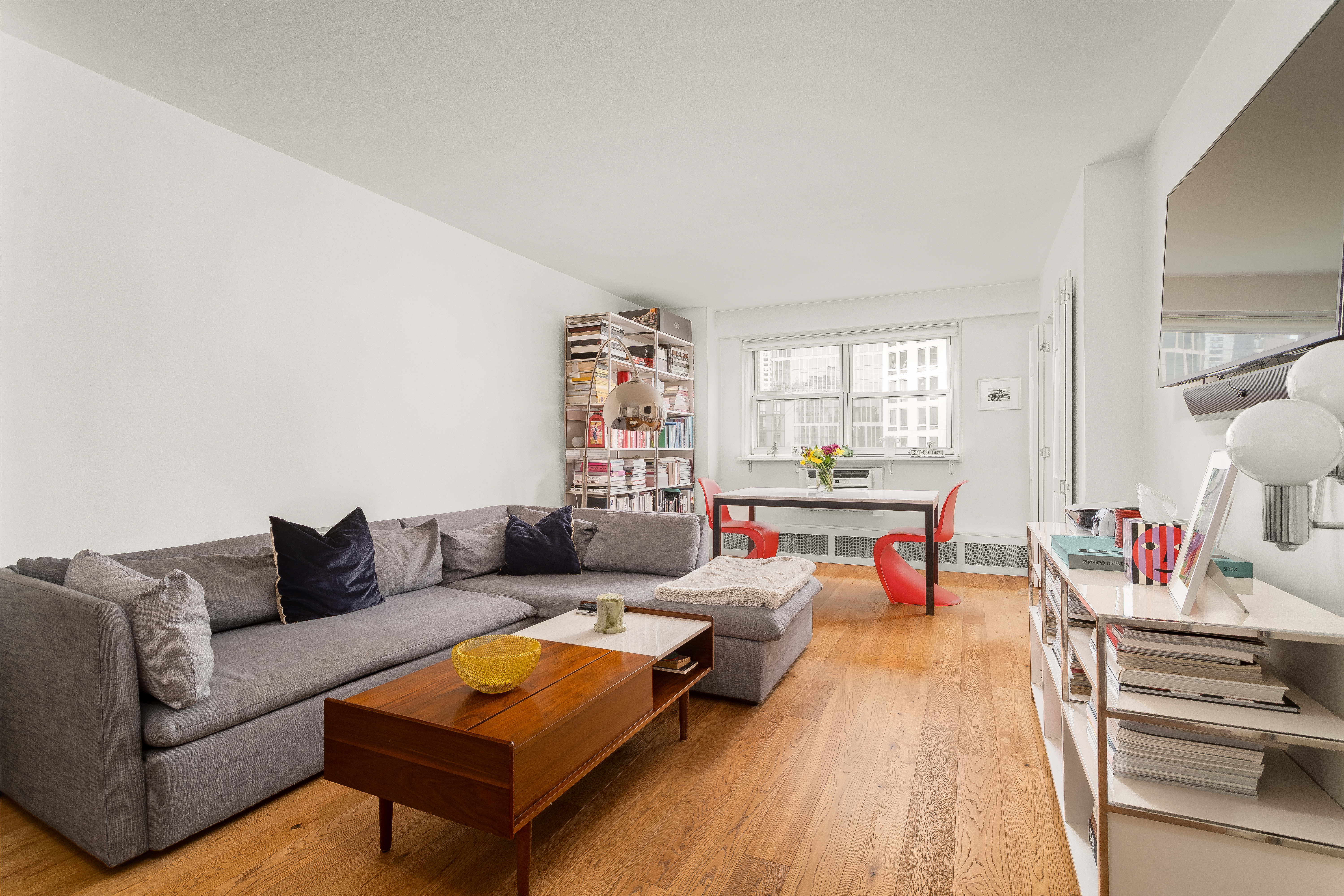 191 Willoughby Street, Unit 12J Brooklyn, NY 11201 - Photo 2 of 19 a living room with furniture and a wooden floor