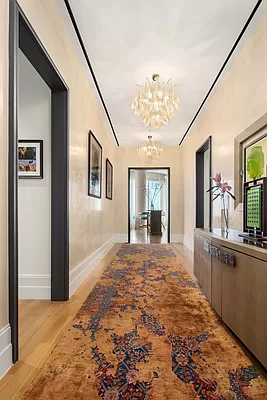 252 East 57th Street, Unit 62B Manhattan, NY 10022 - Photo 12 of 15 a view of a hallway with wooden floor and livingroom