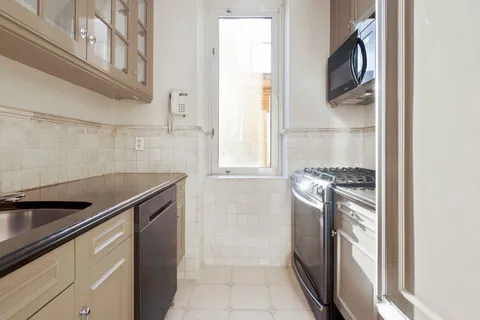 a view of a hallway with washer and dryer