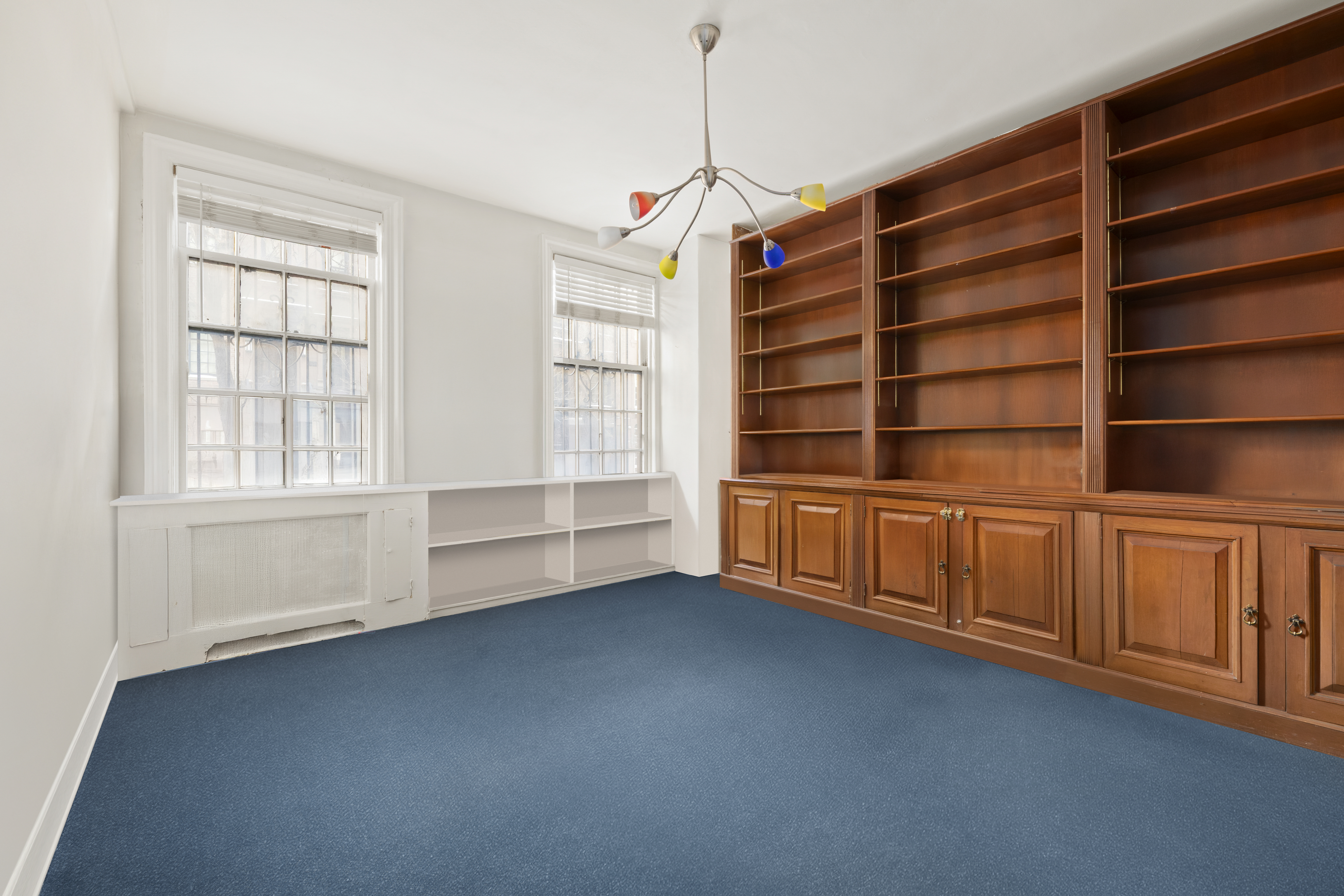162 East 80th Street, Unit 1B Manhattan, NY 10075 - Photo 4 of 10 a view of an empty room with a window and wooden floor