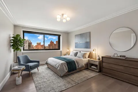 a bed room with a bed and a painting