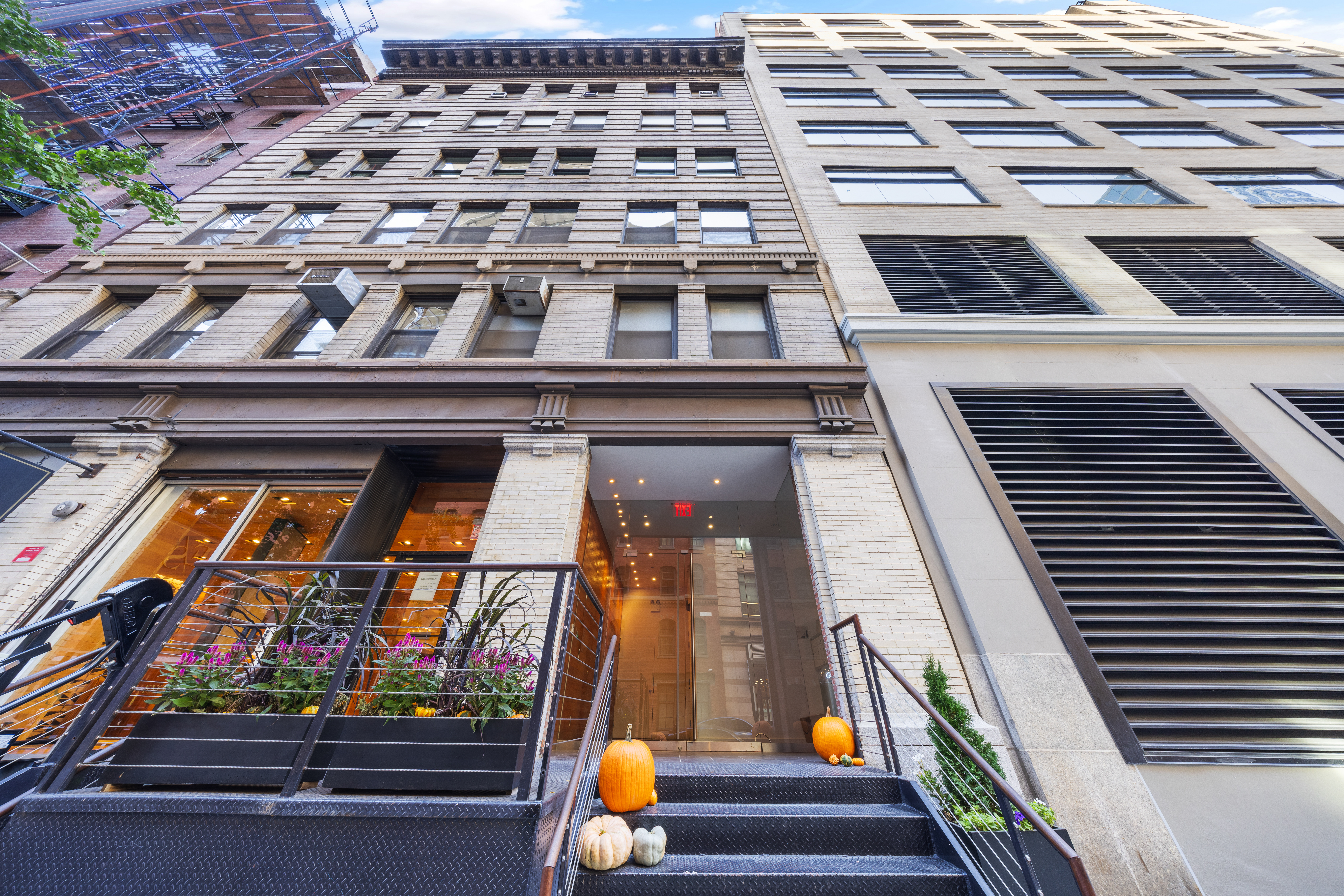 95 Vandam Street, Unit 2R Manhattan, NY 10013 - Photo 20 of 21 a view of a balcony with two chairs and a potted plant