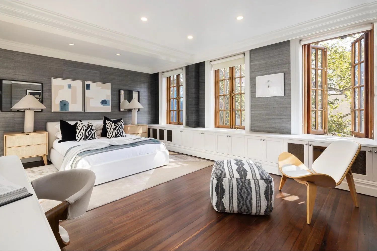 a bedroom with furniture and wooden floor