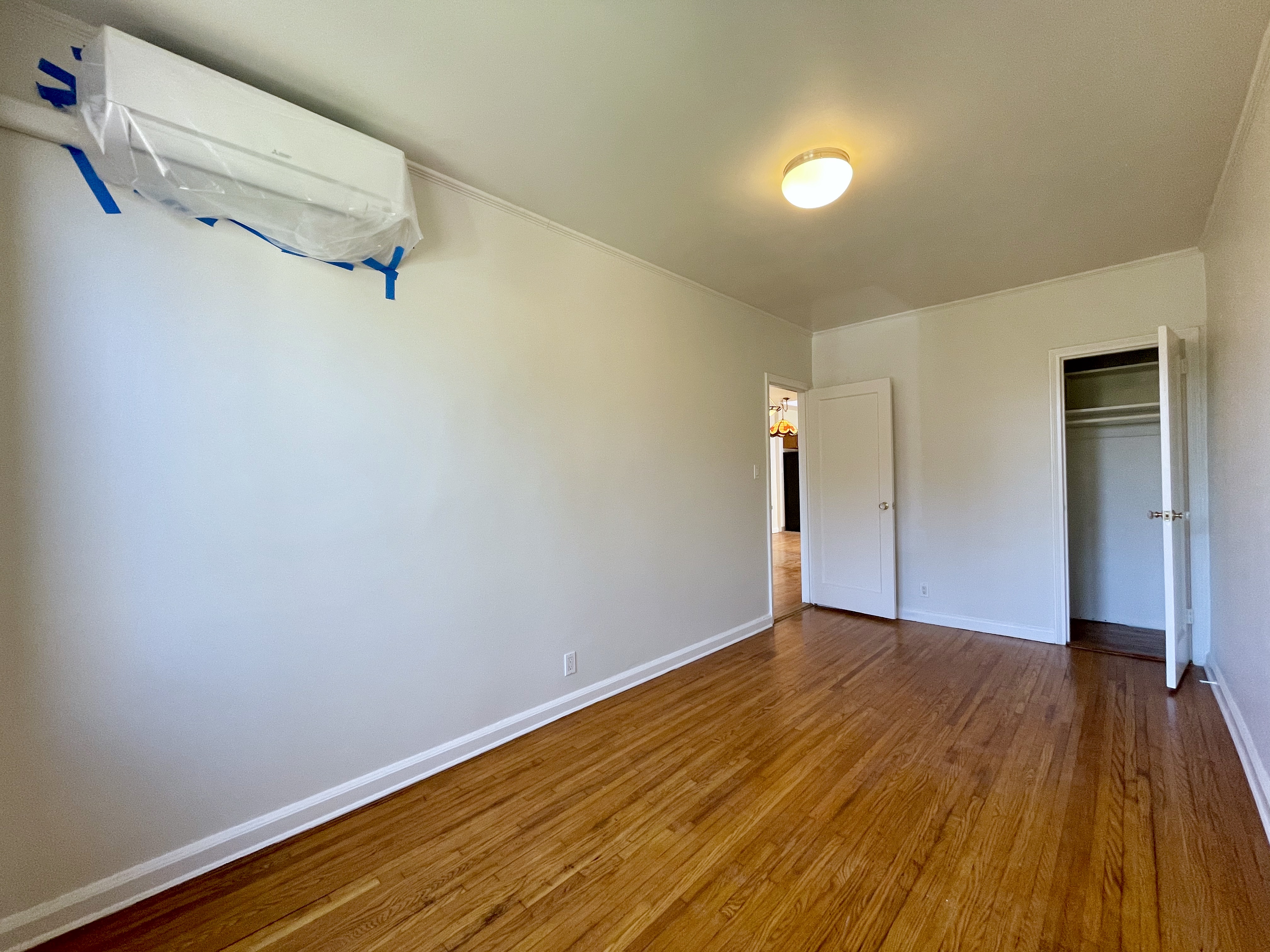 144 96th Street Brooklyn, NY 11209 - Photo 5 of 9 a view of a room with wooden floor