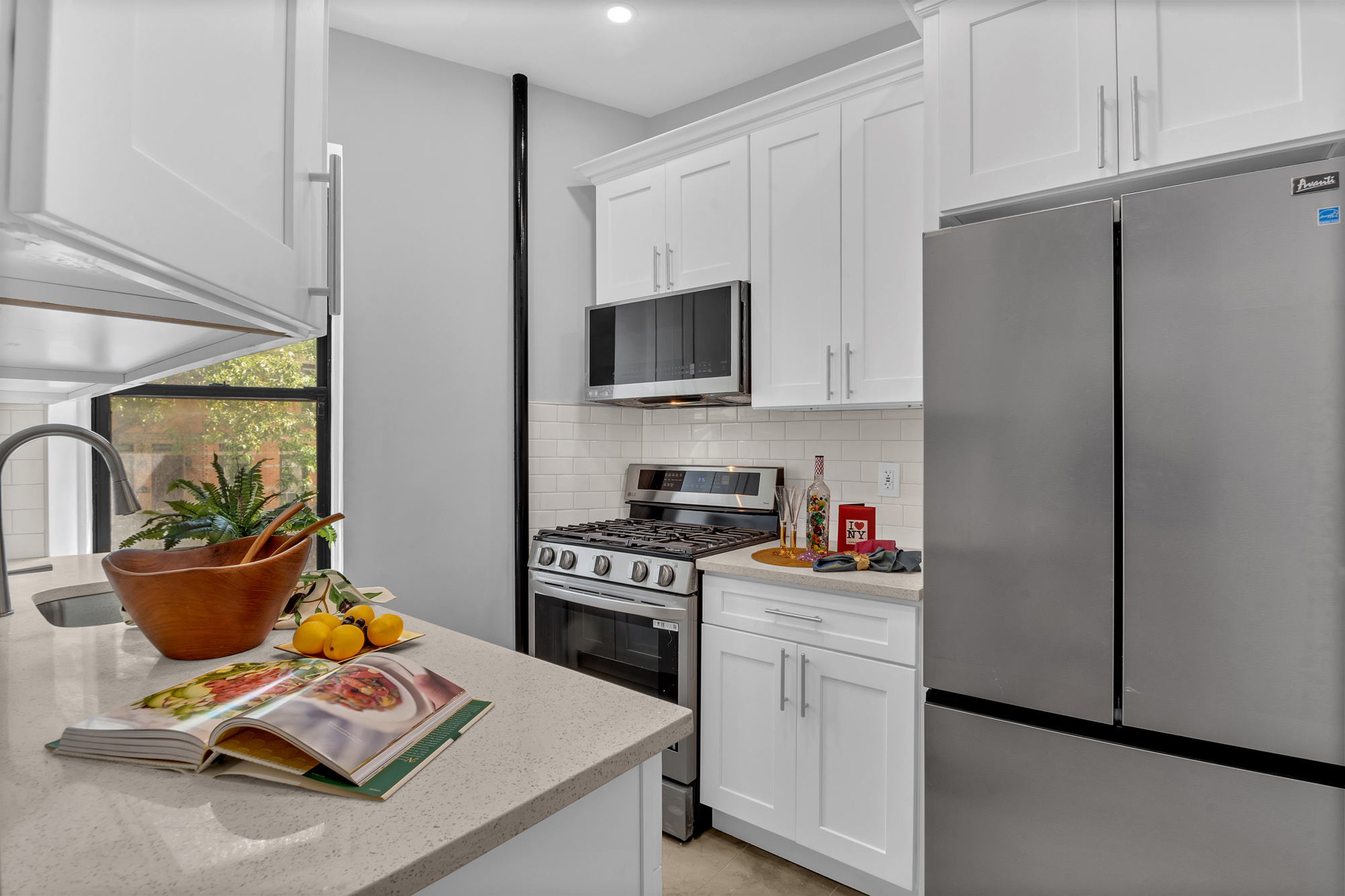 100 Hamilton Place, Unit 2F Manhattan, NY 10031 - Photo 6 of 21 a kitchen with a refrigerator and a stove