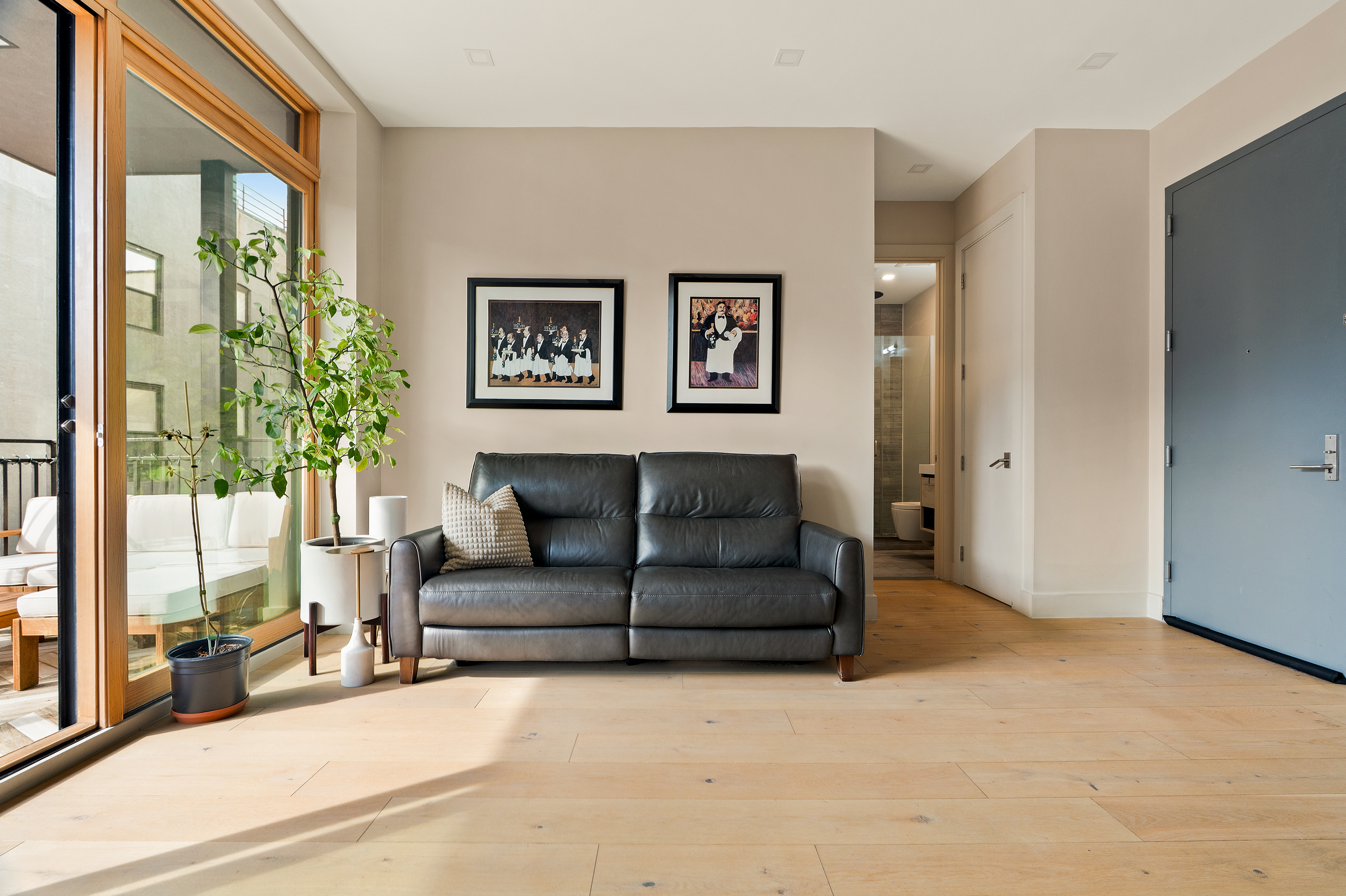 1230 Bedford Avenue, Unit 3R Brooklyn, NY 11216 - Photo 6 of 13 a living room with furniture and a large window
