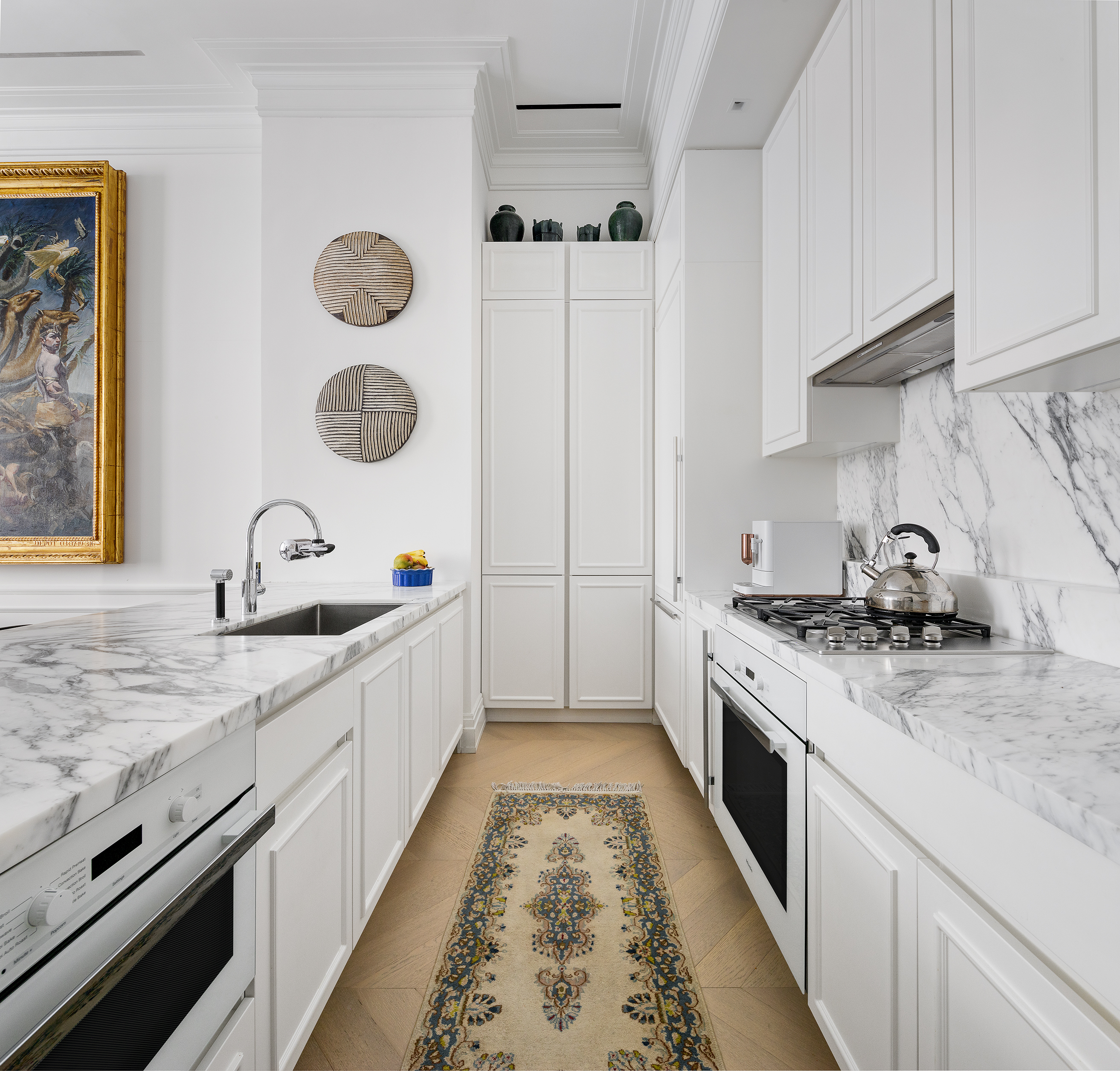 108 Leonard Street, Unit 2A Manhattan, NY 10013 - Photo 4 of 7 a kitchen with granite countertop a sink stove and refrigerator