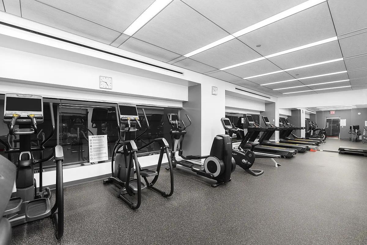 161 West 61st Street, Unit 19D Manhattan, NY 10023 - Photo 6 of 12 a view of a room with gym equipment