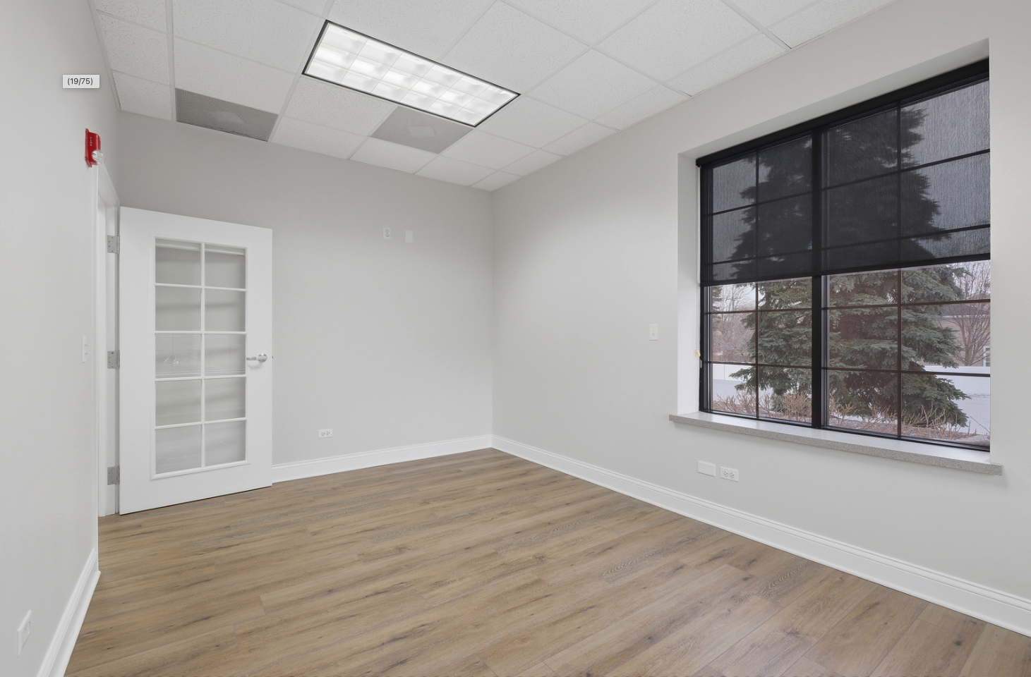 6475 Washington Street Gurnee, IL 60031 - Photo 9 of 45 an empty room with wooden floor and windows