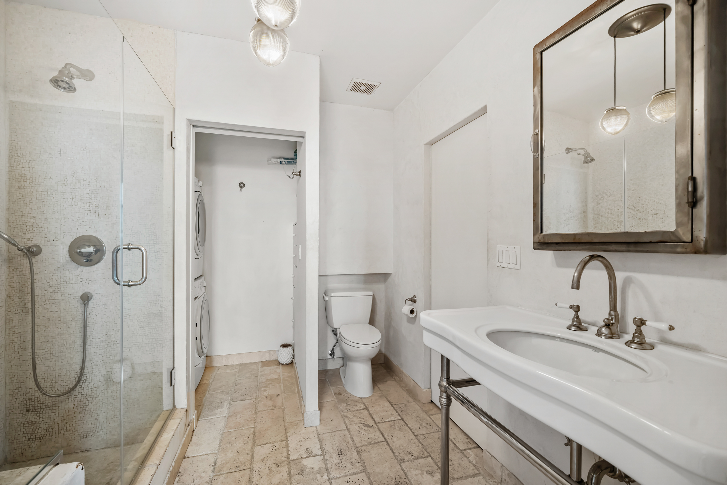 19 Hubert Street, Unit 3 Manhattan, NY 10013 - Photo 6 of 8 a bathroom with a sink a toilet and shower