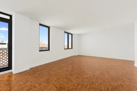 a view of an empty room with windows