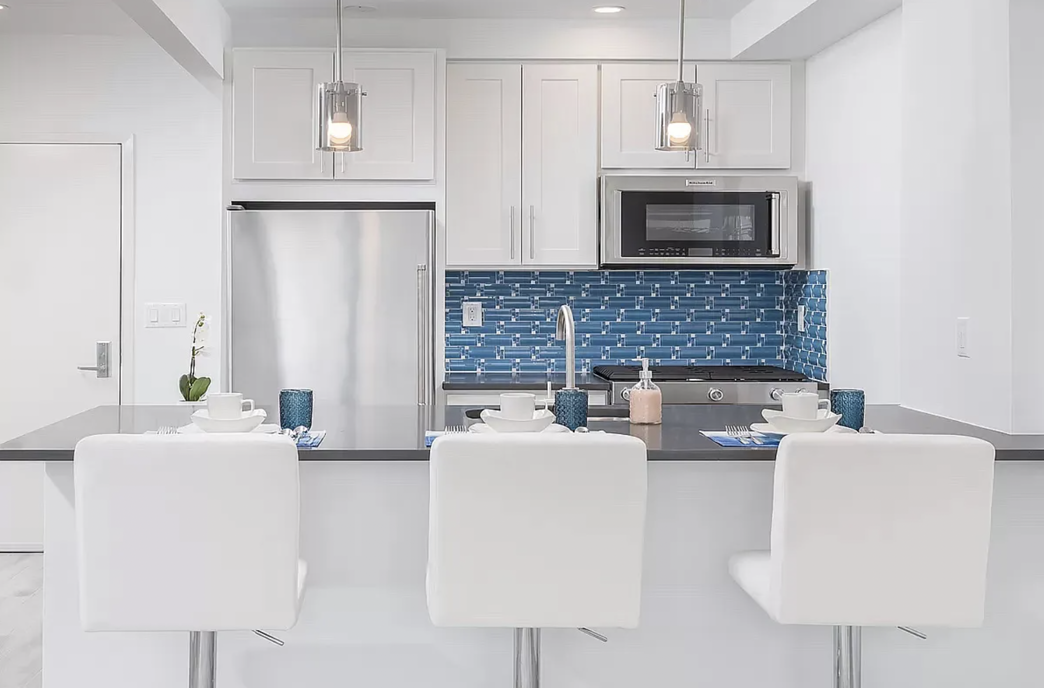 14-11 31st Avenue, Unit 1B Queens, NY 11106 - Photo 1 of 9 a living room with furniture and a fireplace