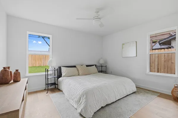 a bedroom with a bed and a window