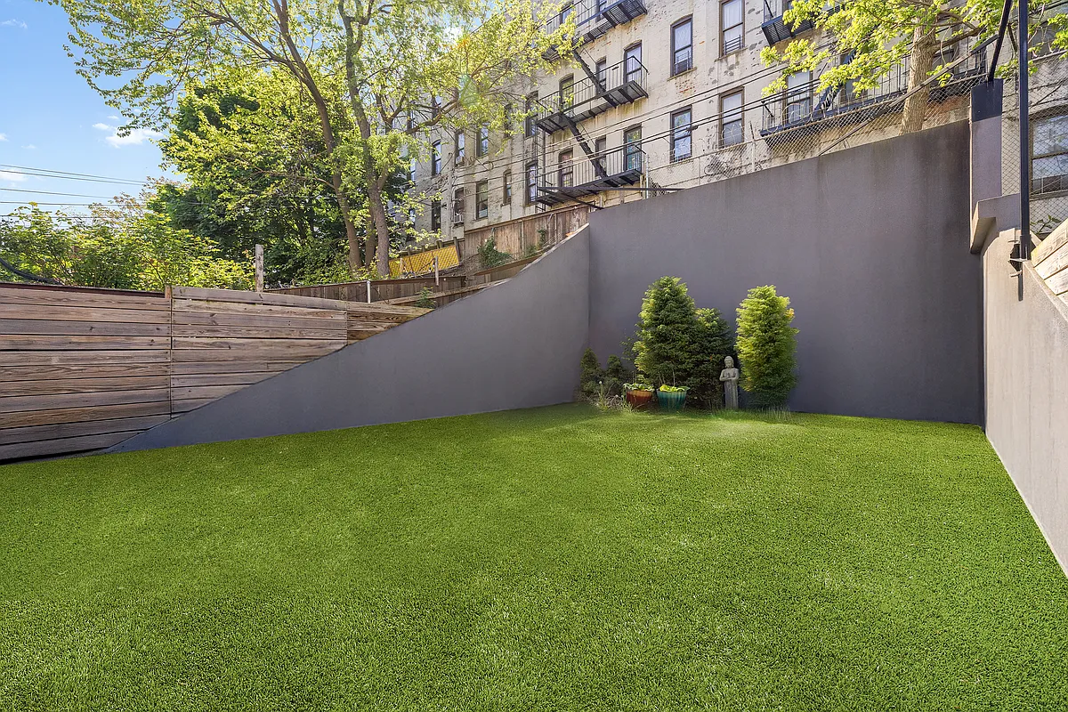 Saint Marks Avenue Brooklyn, NY 11213 - Photo 13 of 16 a backyard of a house with lots of green space