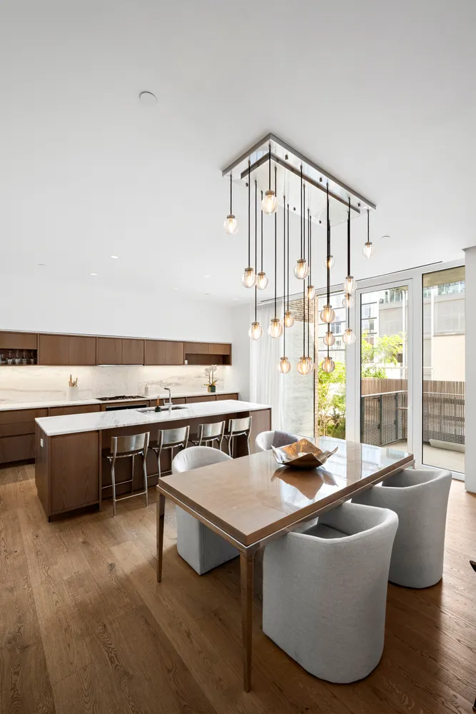 a living room with furniture a flat screen tv and outdoor view