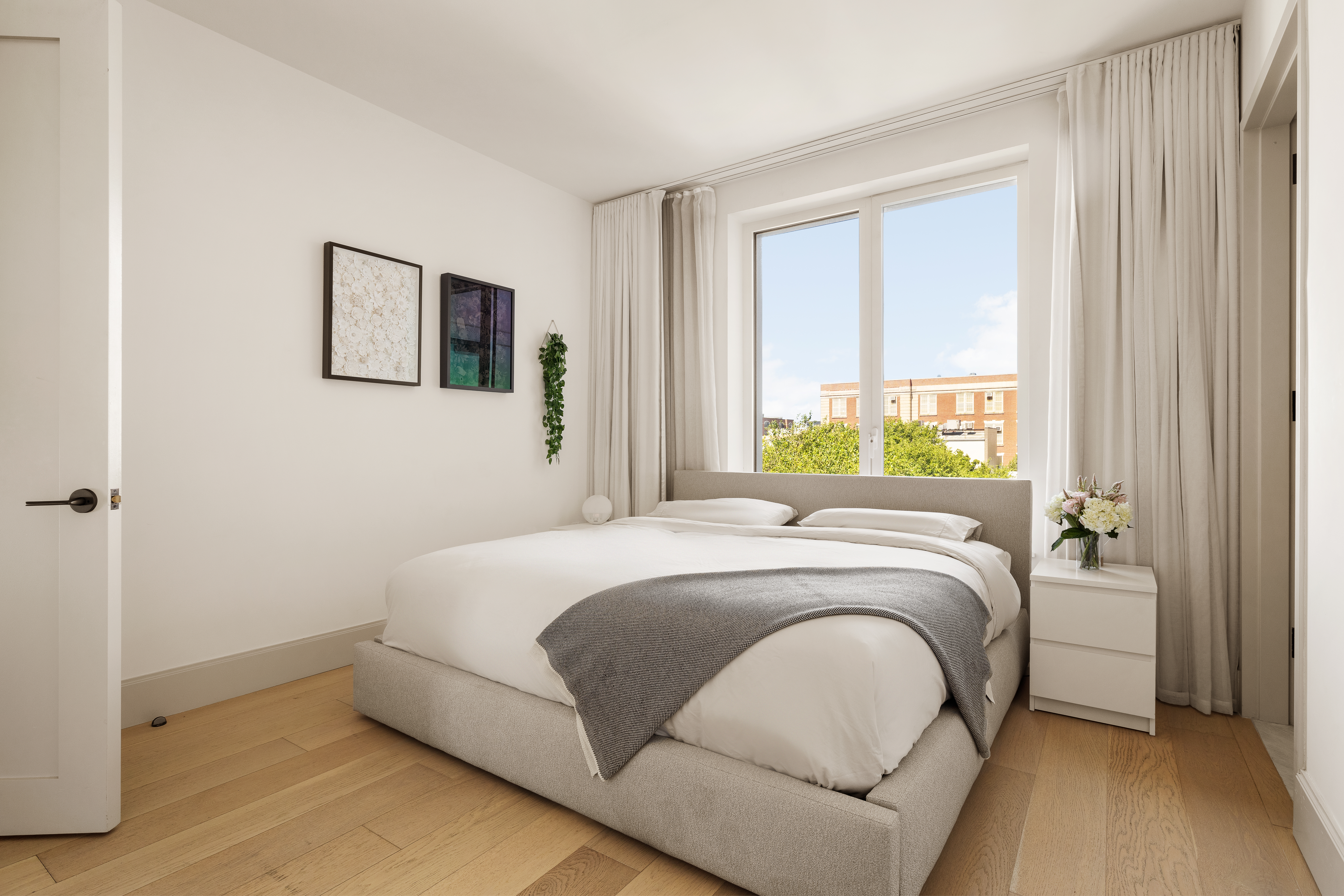 308 North 7th Street, Unit 5A Brooklyn, NY 11211 - Photo 6 of 12 a bedroom with a bed and a window