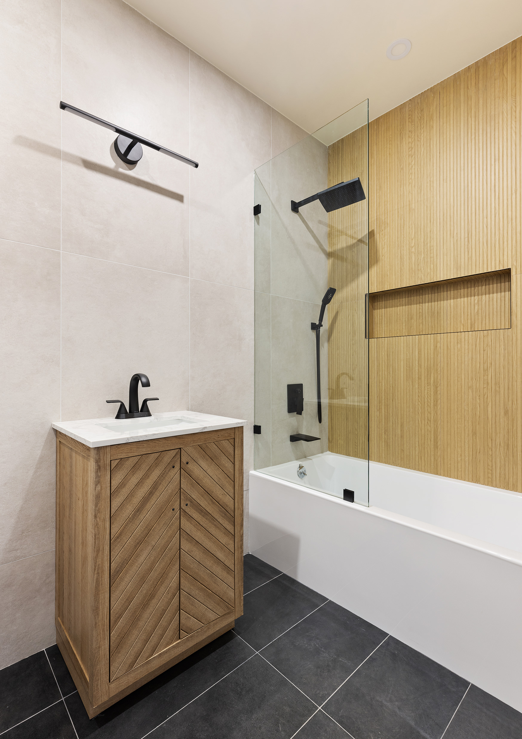 152 North 10th Street, Unit 1L Brooklyn, NY 11249 - Photo 13 of 18 a bathroom with a tub a sink and a shower