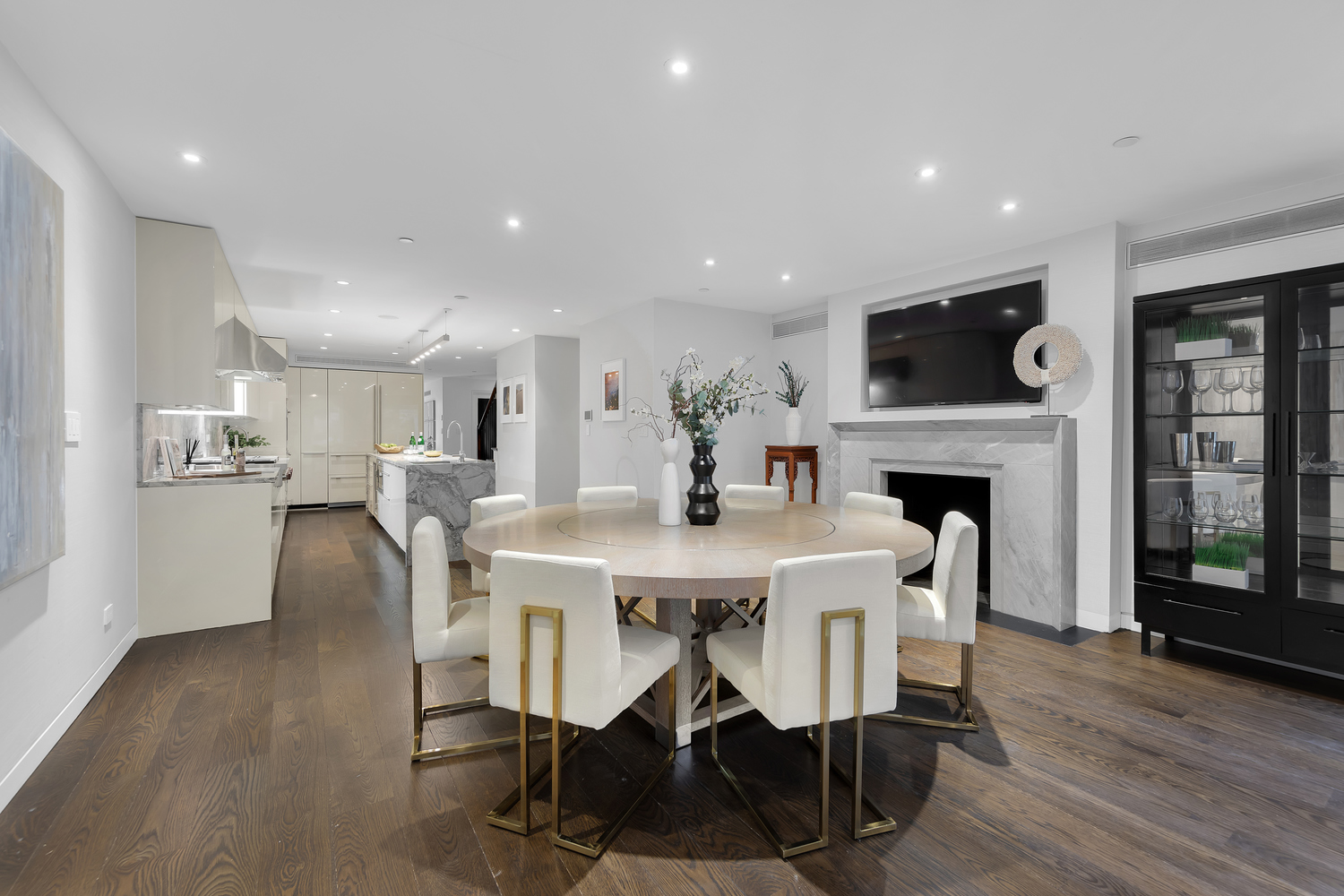 42 West 71st Street Manhattan, NY 10023 - Photo 11 of 35 a dining room with furniture a wooden floor and a fireplace