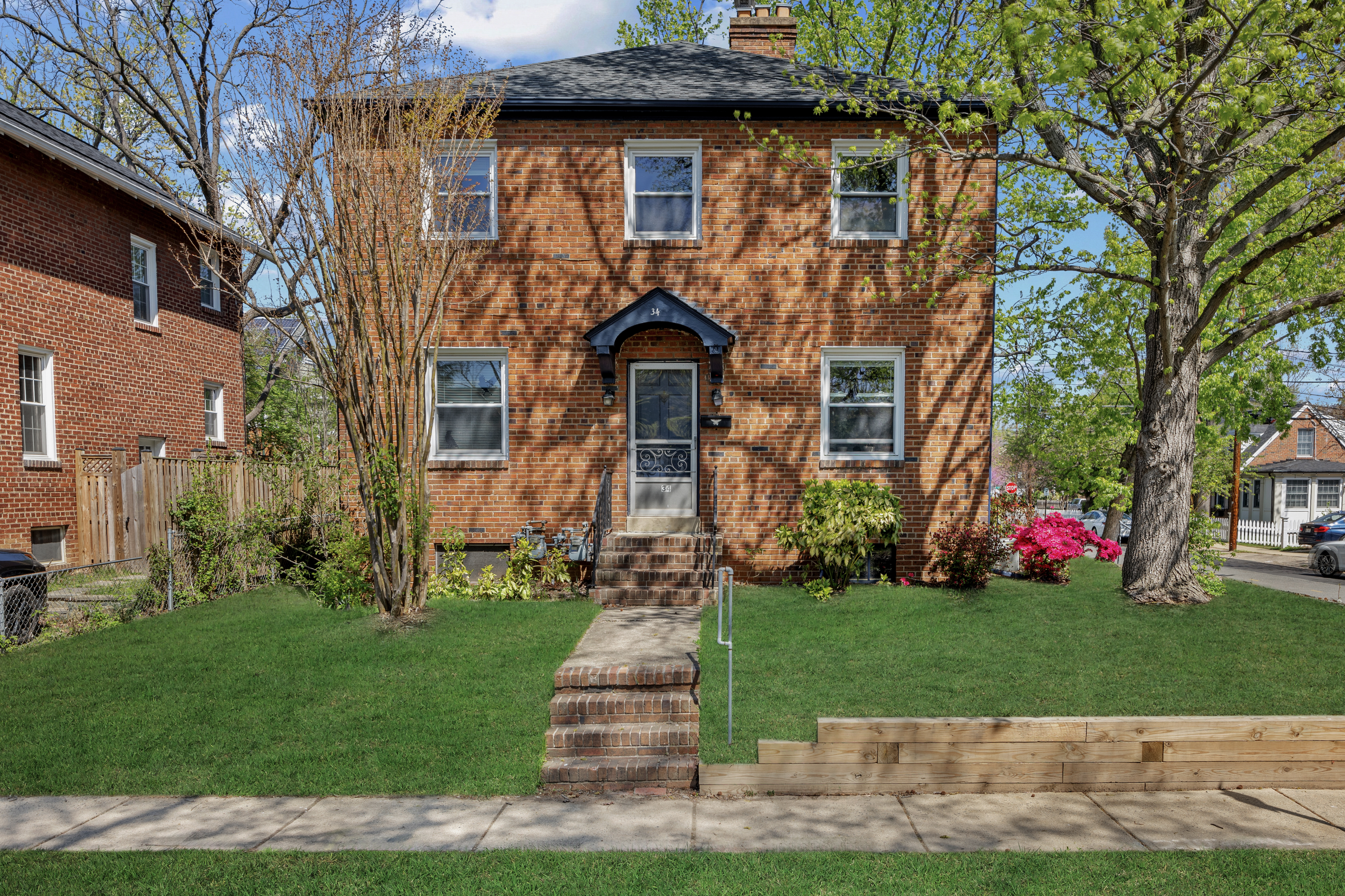 34 East Walnut Street Alexandria, VA 22301 - Photo 13 of 15 a front view of a house with a yard