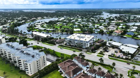 an aerial view of multiple house with yard