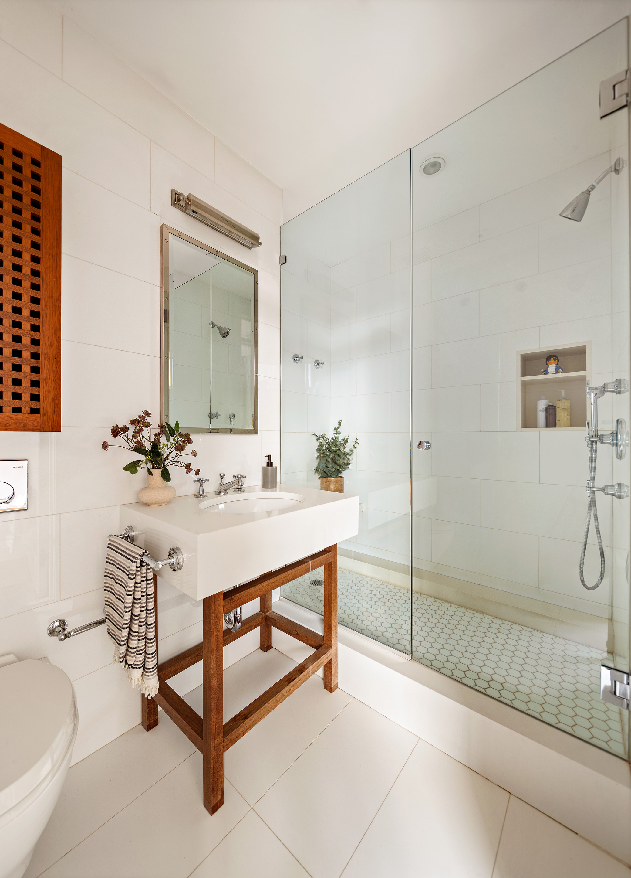2 Cornelia Street, Unit 506 Manhattan, NY 10014 - Photo 7 of 11 a bathroom with a sink and a mirror