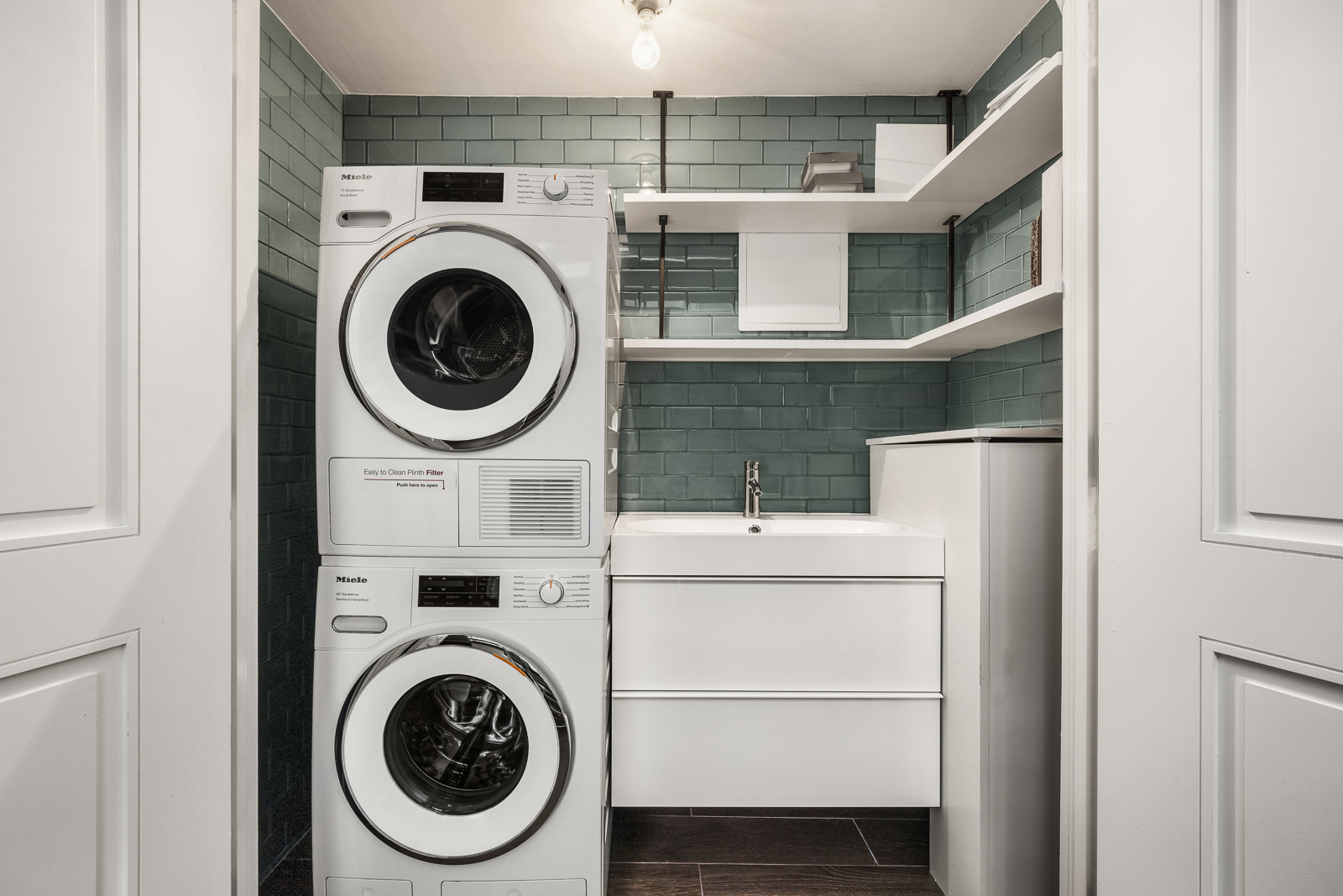 137 Franklin Street, Unit 1 Manhattan, NY 10013 - Photo 23 of 25 a close up view of a washer and dryer