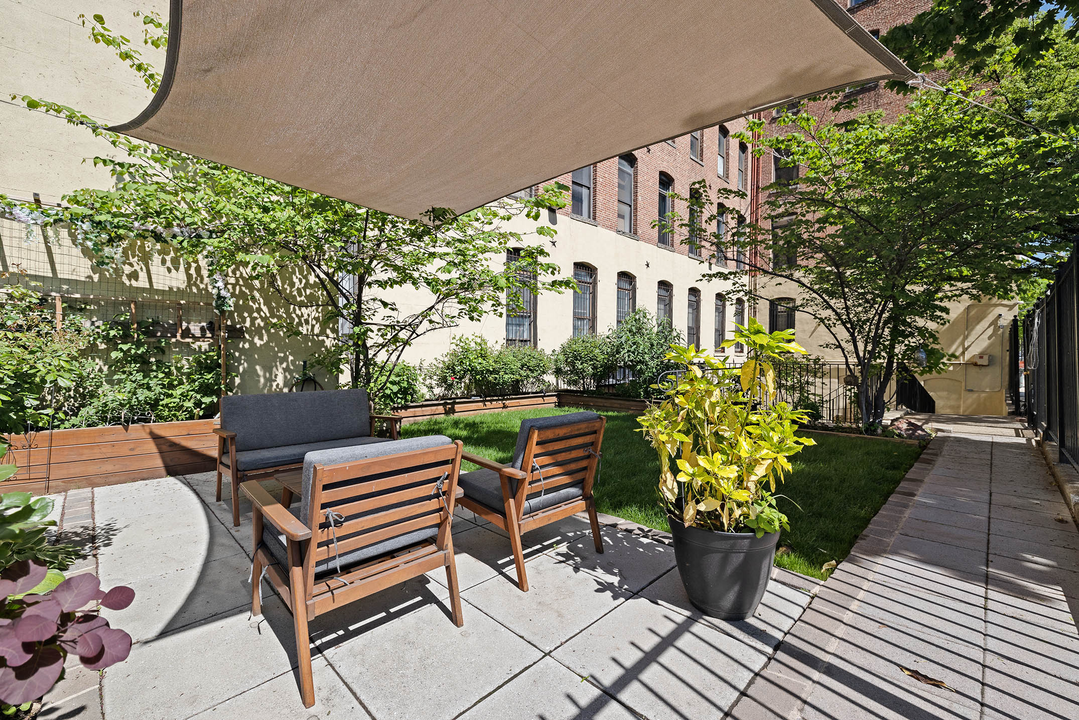 1 Tiffany Place, Unit 2F Brooklyn, NY 11231 - Photo 8 of 12 a patio with table and chairs and potted plants