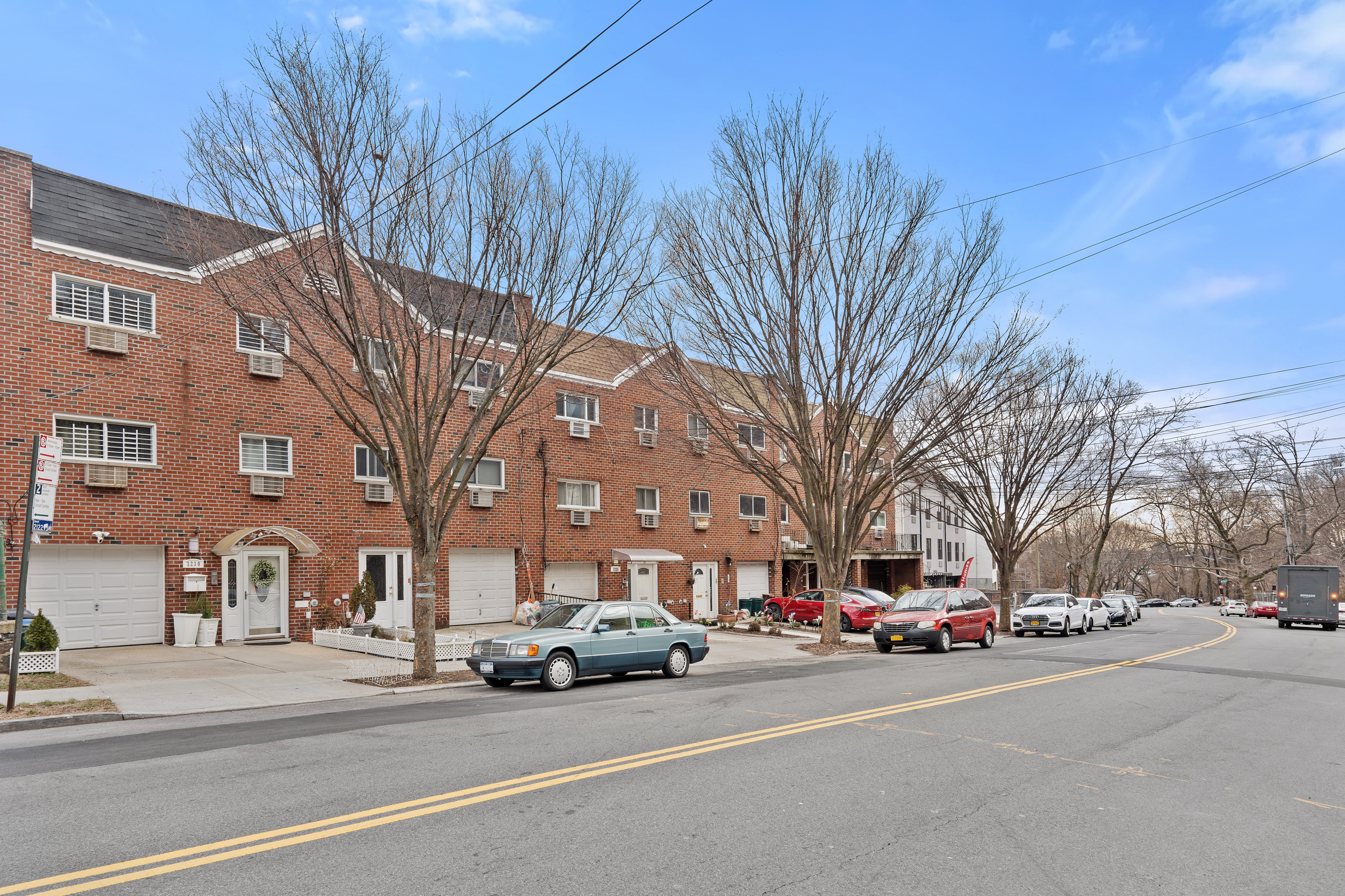 3230 Johnson Avenue, Unit 3 Bronx, NY 10463 - Photo 20 of 21 a view of a cars parked on the side of a street