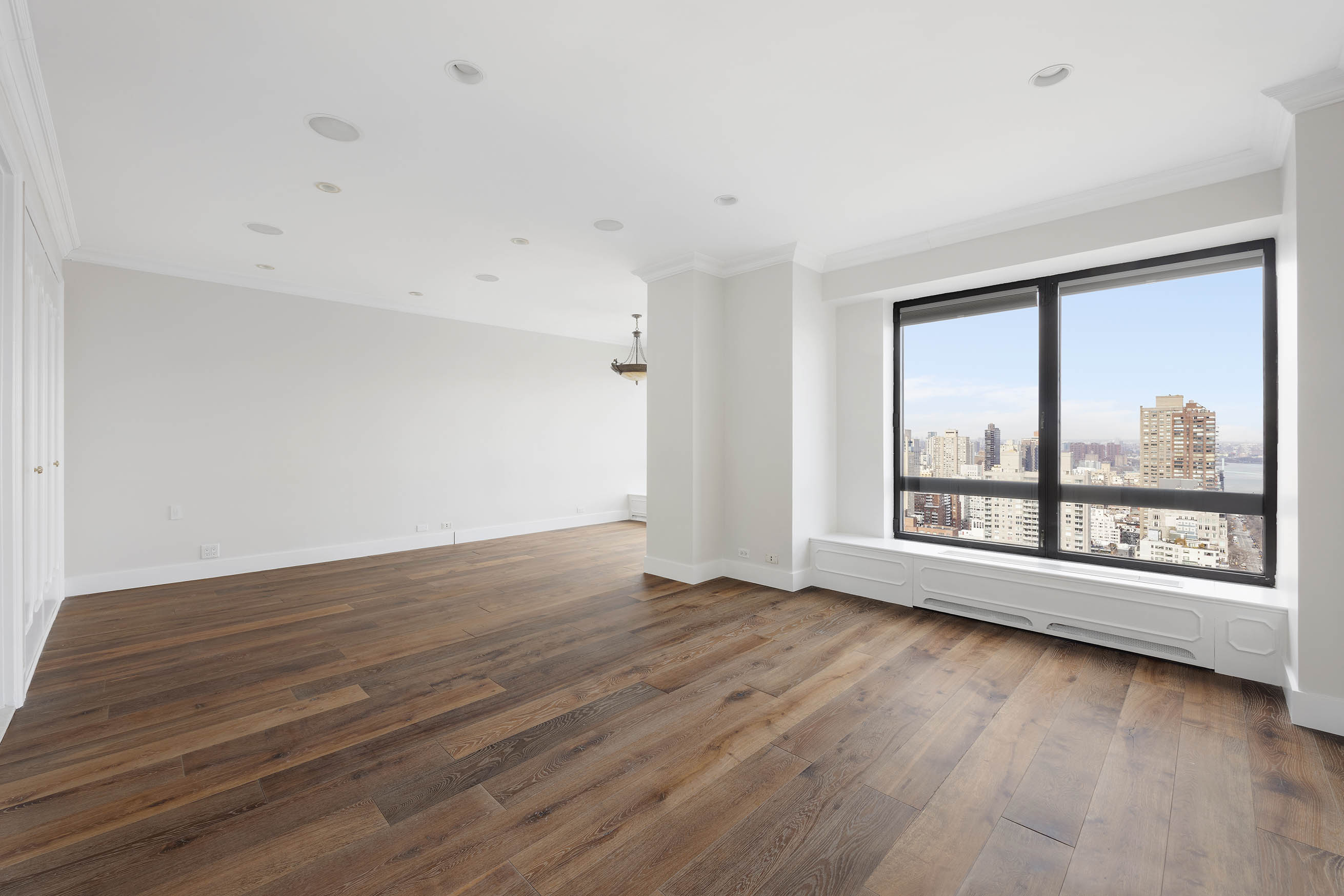 530 East 76th Street, Unit PH36/37E Manhattan, NY 10021 - Photo 13 of 29 wooden floor in an empty room with a window