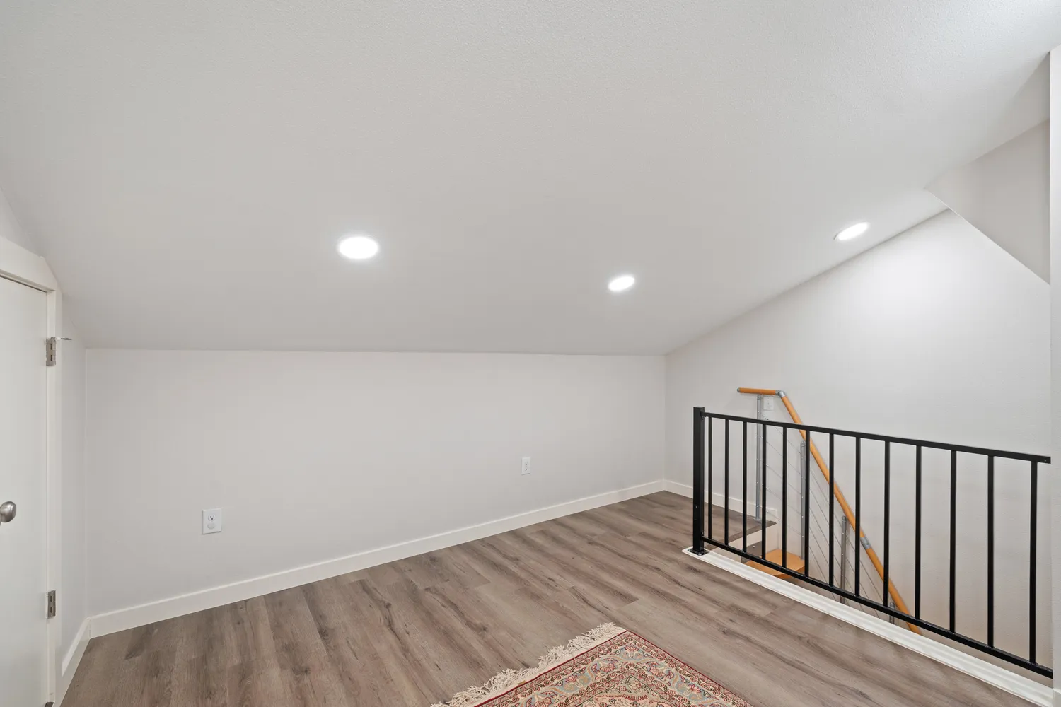 a bedroom with a bed and a chair