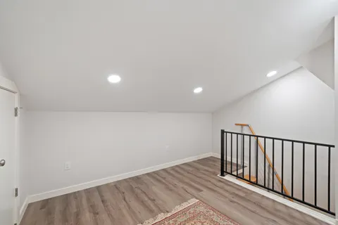 a bedroom with a bed and a chair