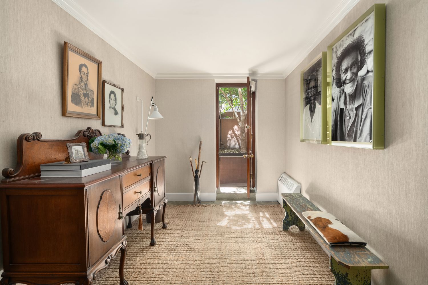 a view of a workspace with furniture and hallway