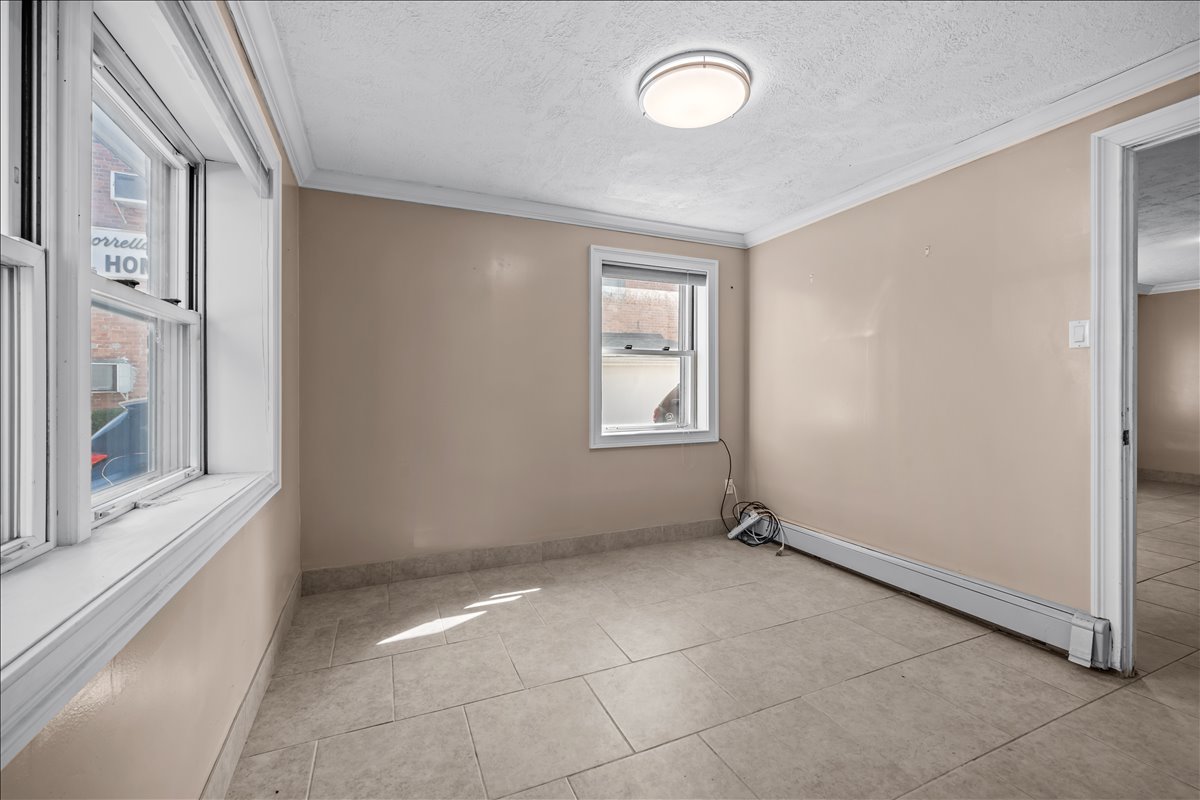100-14 159th Avenue Queens, NY 11414 - Photo 9 of 26 a view of an empty room with a window