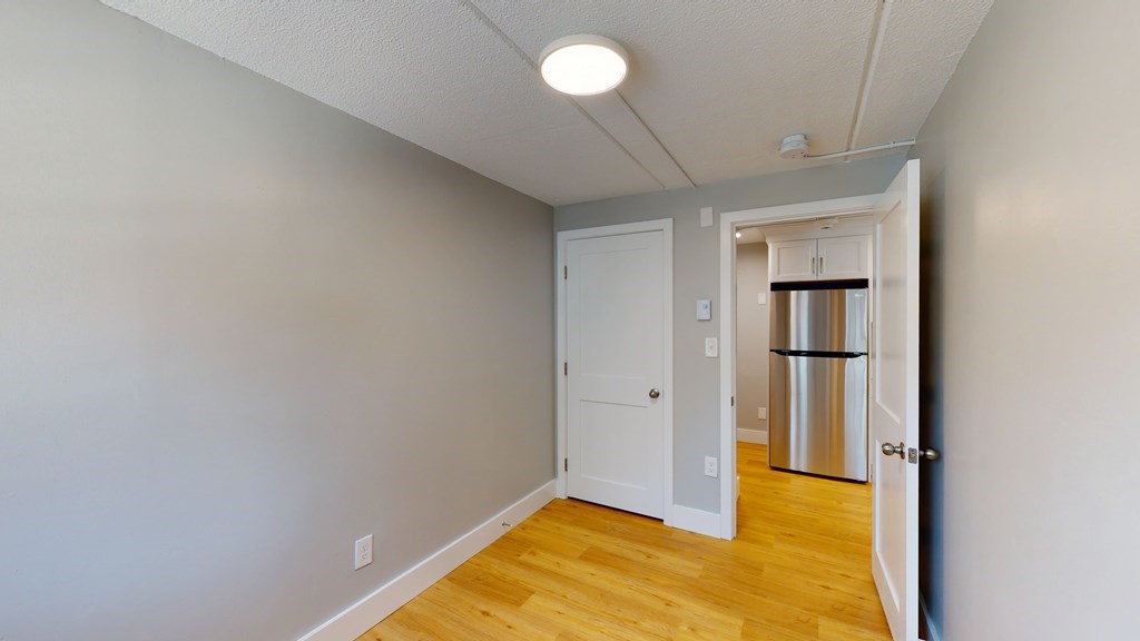 89 Woodrow Avenue, Unit 6 Boston, MA 02124 - Photo 5 of 8 a view of an empty room