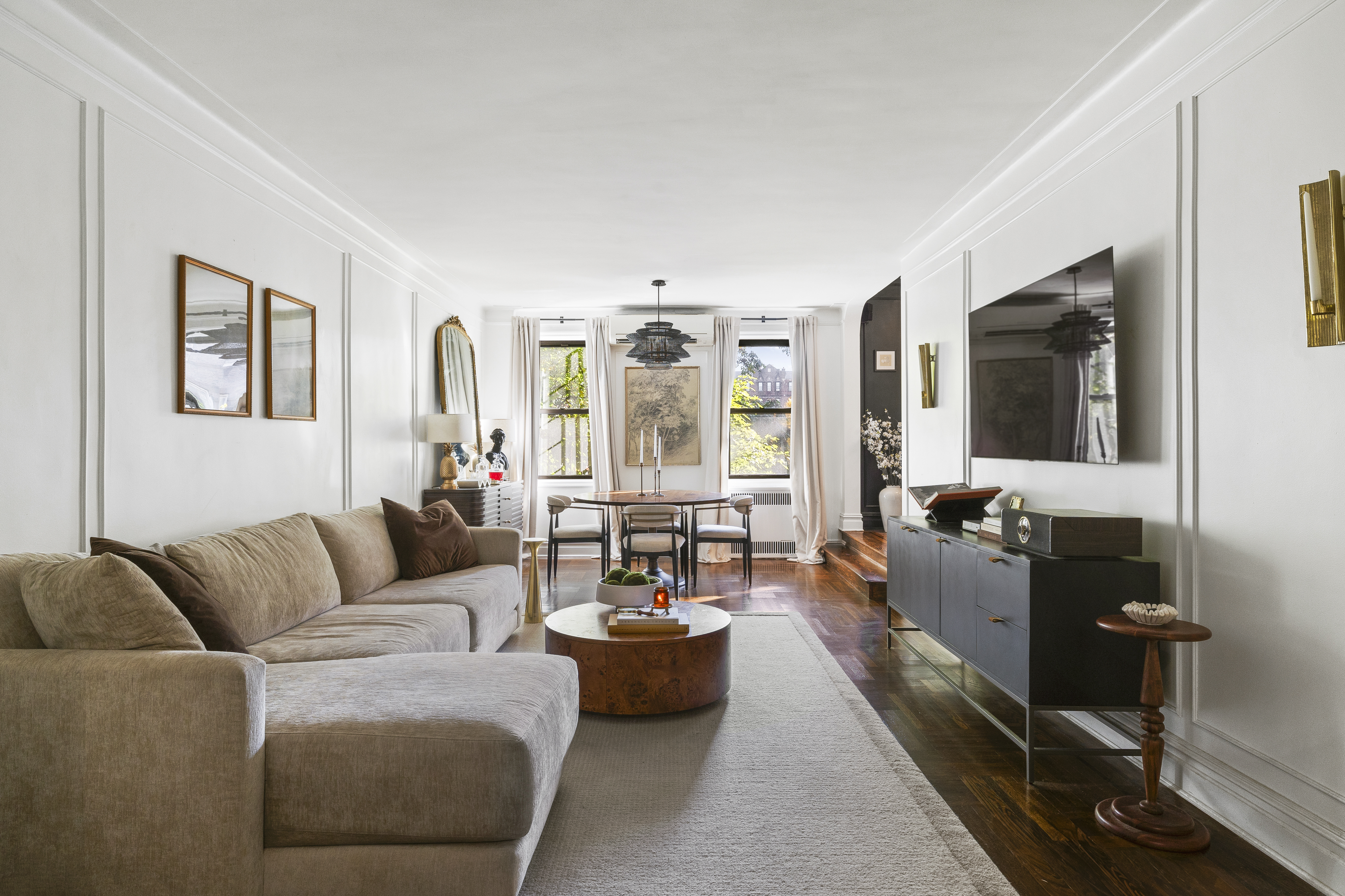 125 Ocean Avenue, Unit 2G Brooklyn, NY 11225 - Photo 2 of 16 a living room with furniture and a flat screen tv