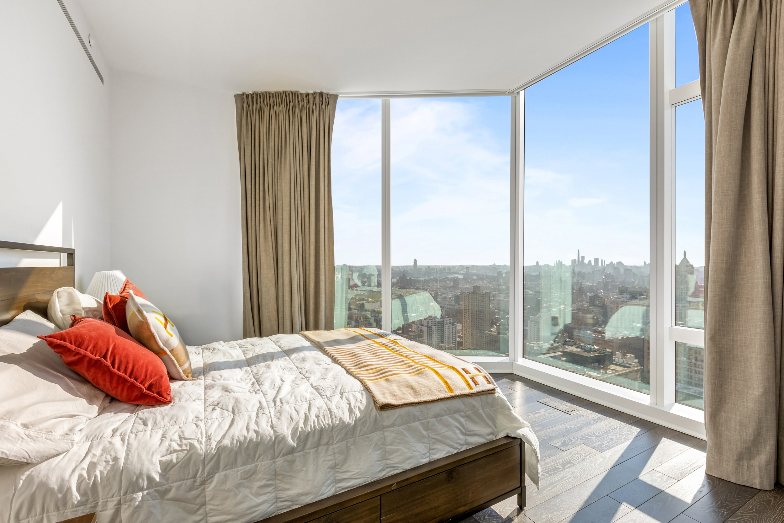 45 East 22nd Street, Unit 42B Manhattan, NY 10010 - Photo 5 of 23 a bedroom with a bed and a large window