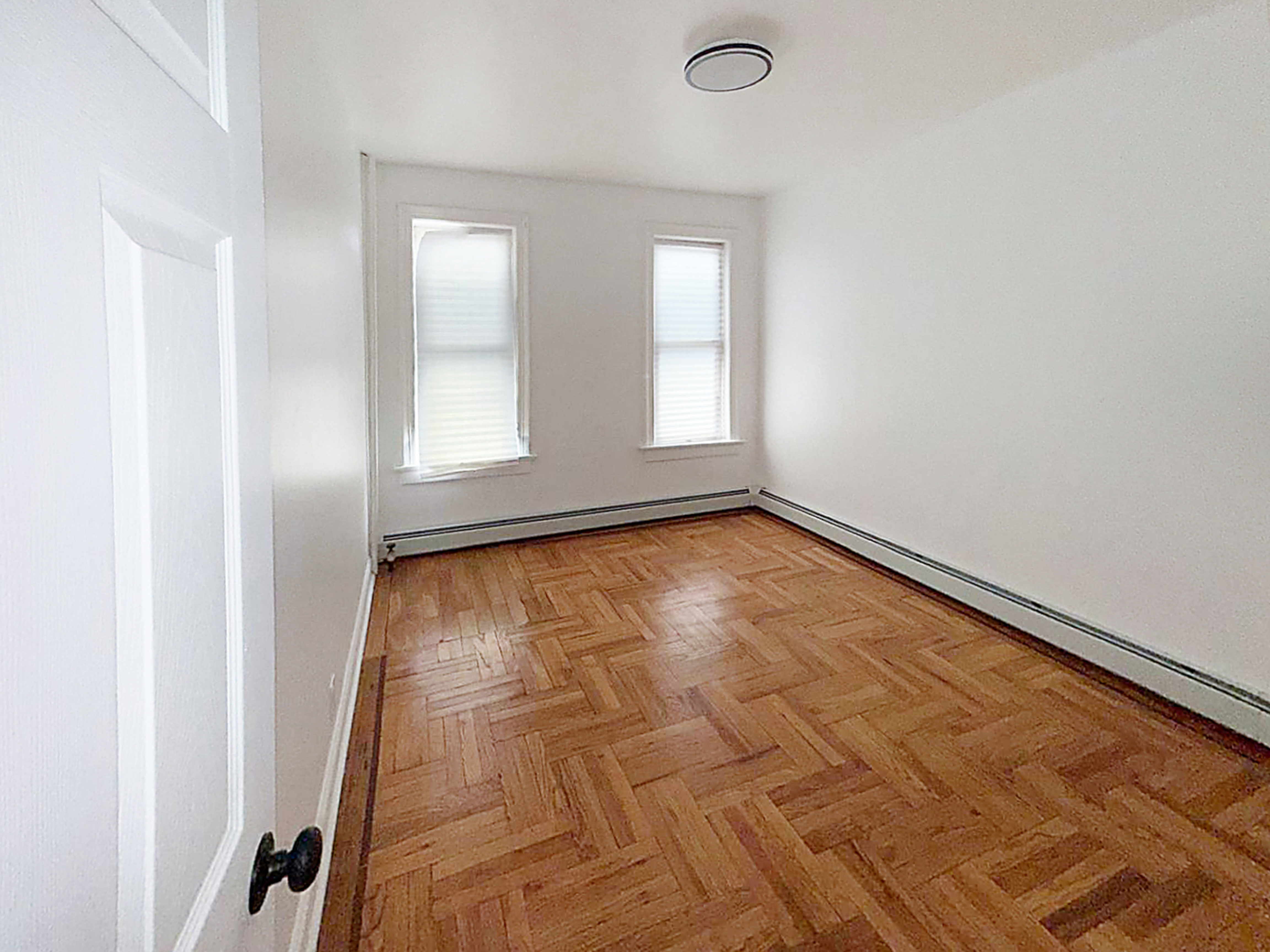319 East 49th Street, Unit 1 Brooklyn, NY 11203 - Photo 6 of 8 an empty room with a window
