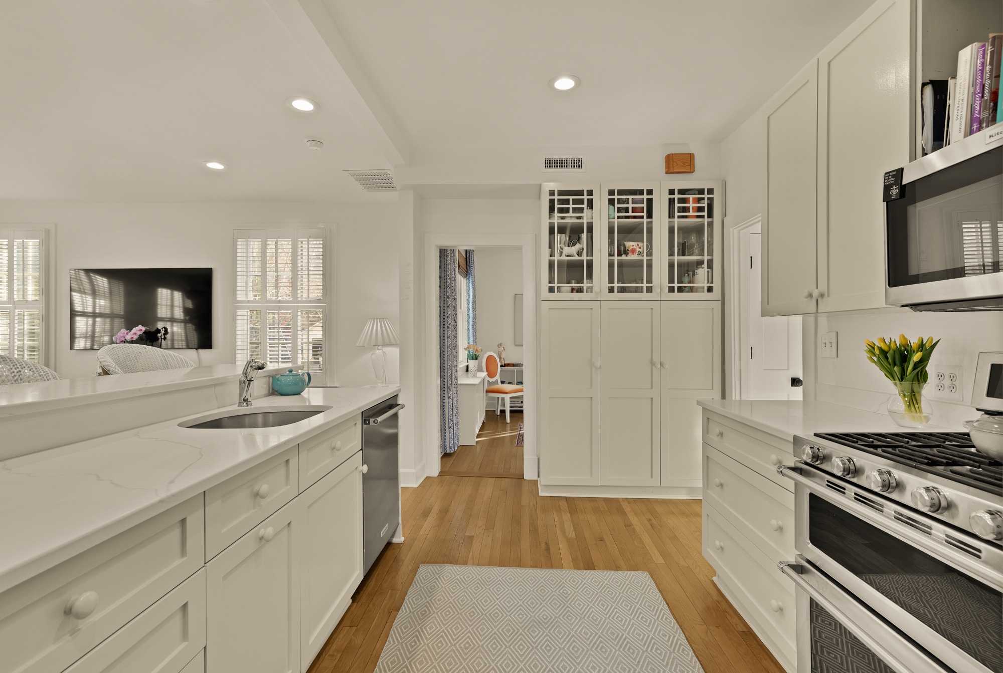 6815 Delaware Street Chevy Chase, MD 20815 - Photo 6 of 34 a large kitchen with stainless steel appliances granite countertop a stove and a sink