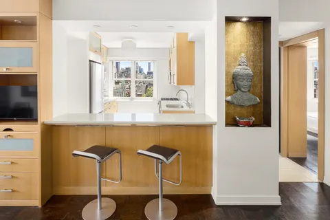 a kitchen with a table and a chair
