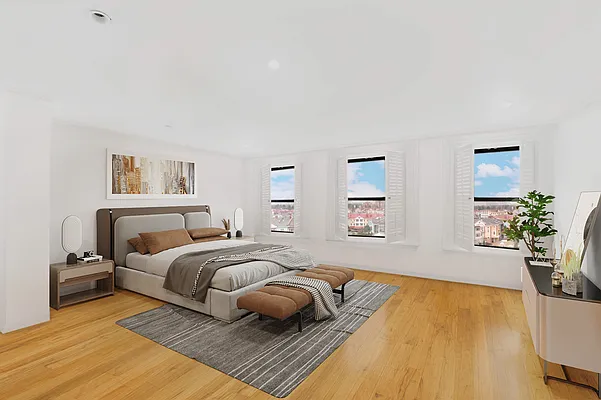 152 East 74th Street, Unit 2 Manhattan, NY 10021 - Photo 7 of 16 a bedroom with a bed and a couch