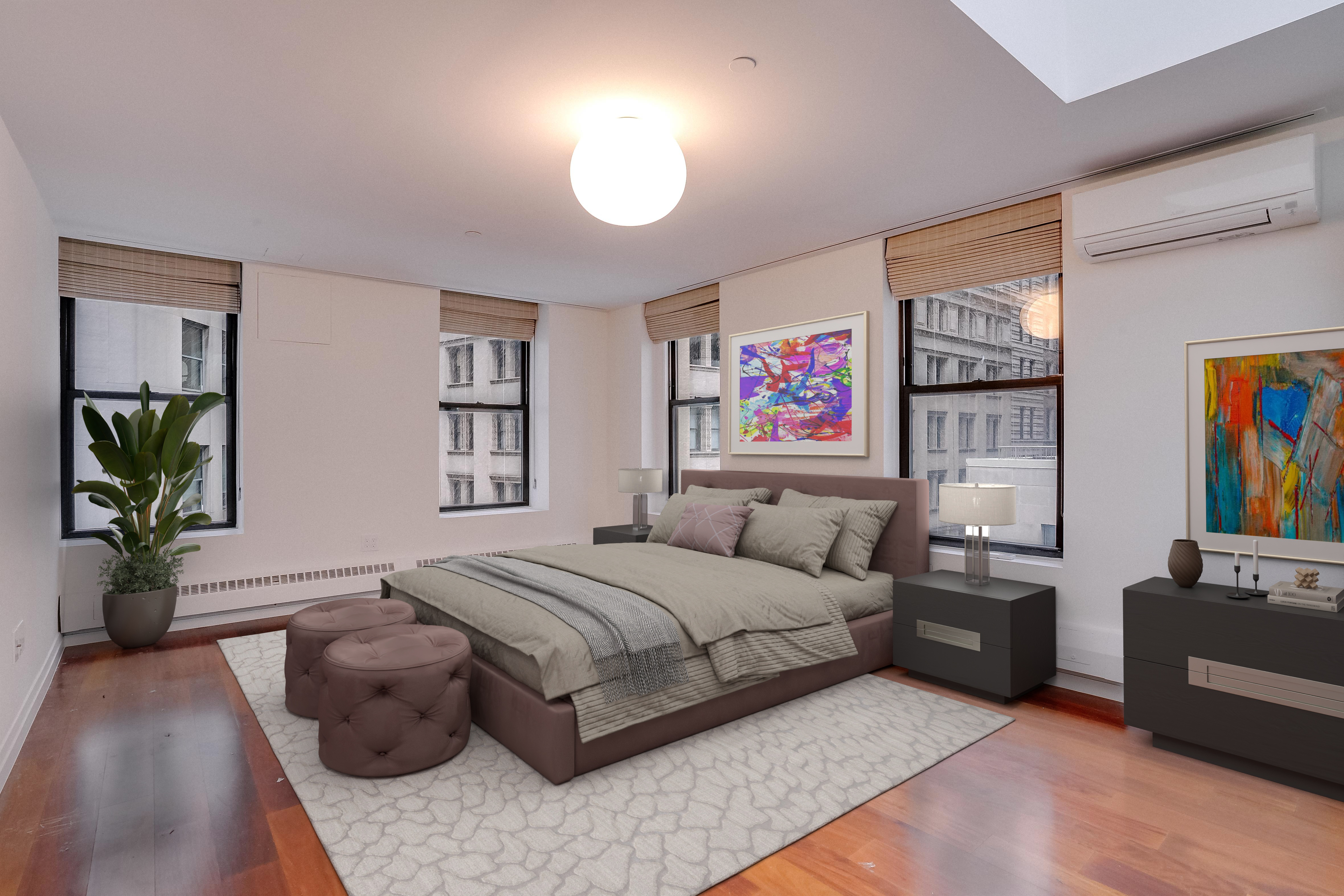 55 Wall Street, Unit PH910 Manhattan, NY 10005 - Photo 7 of 19 a bedroom with a bed furniture and paintings on the wall