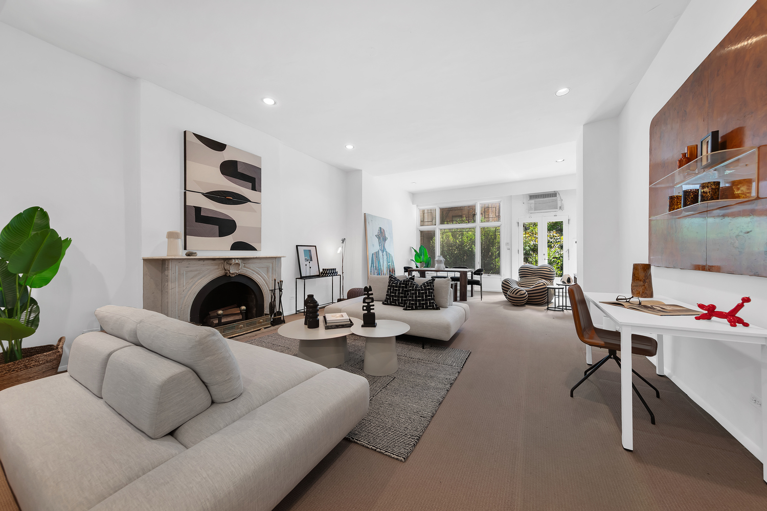206 East 30th Street Manhattan, NY 10016 - Photo 2 of 17 a living room with furniture fireplace and window