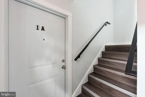 a view of staircase with white walls