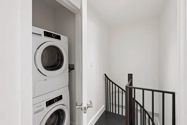 a view of a hallway with washer and dryer