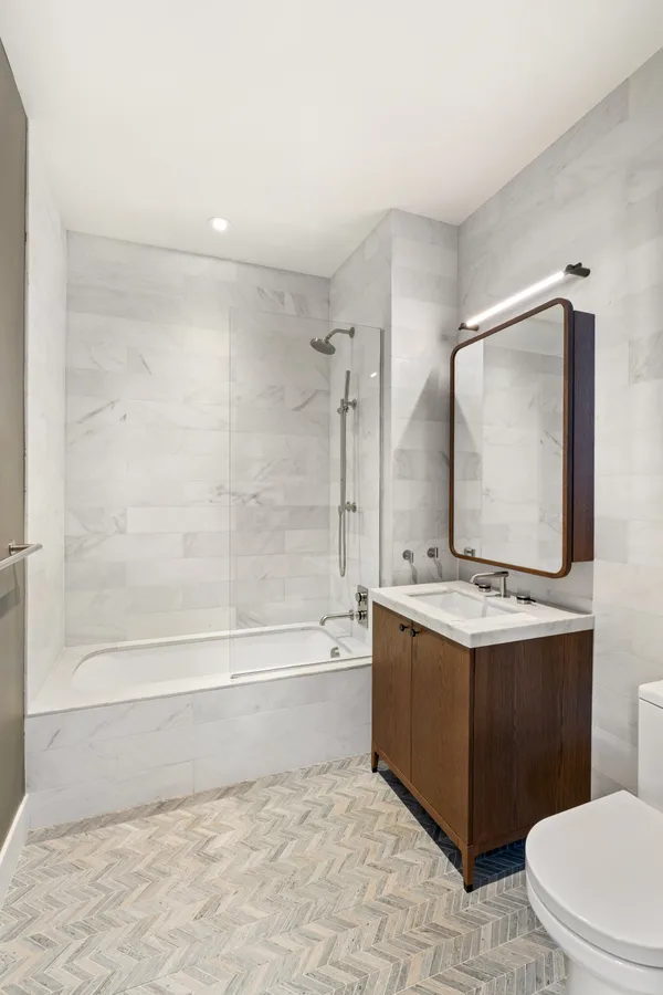 a bathroom with a sink a toilet and a bathtub