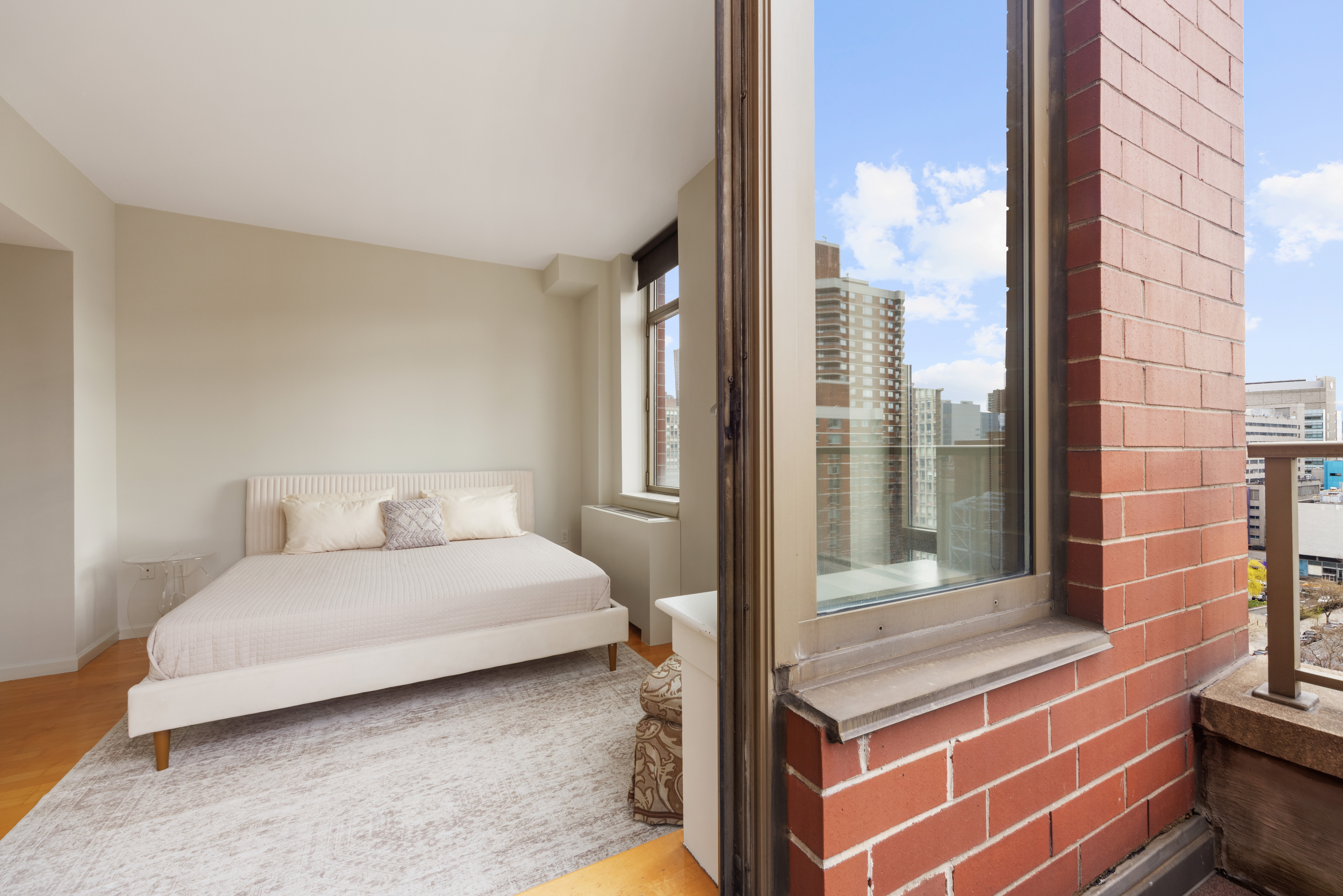 250 East 30th Street, Unit 14B Manhattan, NY 10016 - Photo 10 of 14 a bedroom with a bed and a window